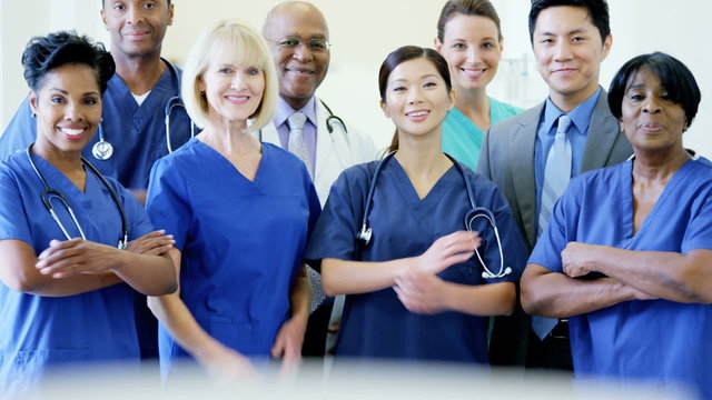 Portrait of confident teamwork multi ethnic male female staff doctor in hospital
