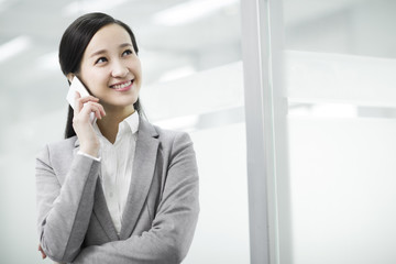 Happy businesswoman talking on the phone
