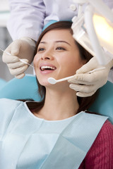 Patient receiving treatment in dental clinic © Blue Jean Images