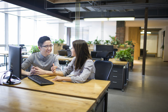 IT workers talking in office