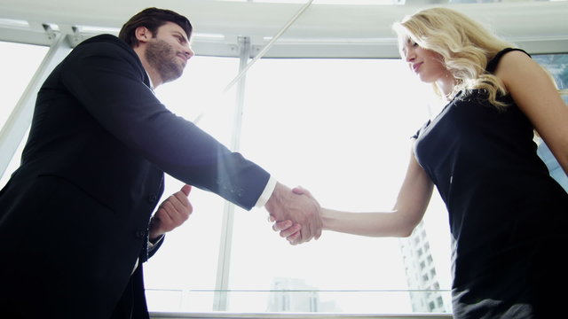 handshake male American female Russian business real estate property development