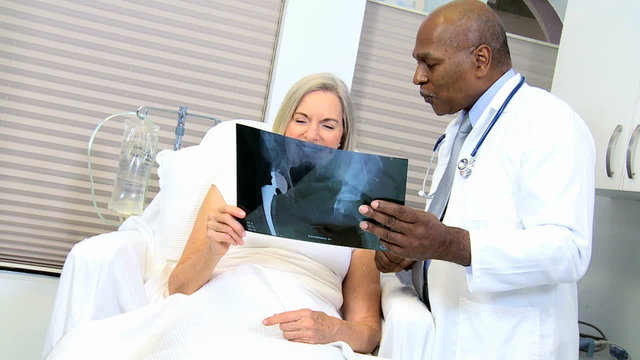 medical health hospital African American doctor Caucasian female senior x-ray