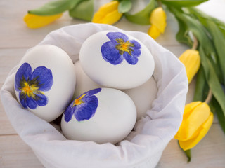 Painted Easter eggs in the white linen bag