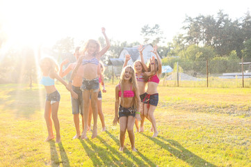 Obraz premium Portrait of happy children on nature in summer