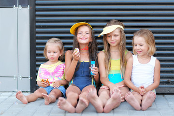 Portrait of happy children on nature in summer