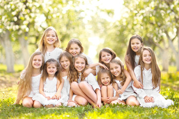 Portrait of happy children on nature in summer