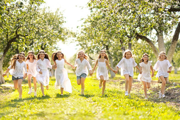 Obraz premium Portrait of happy children on nature in summer