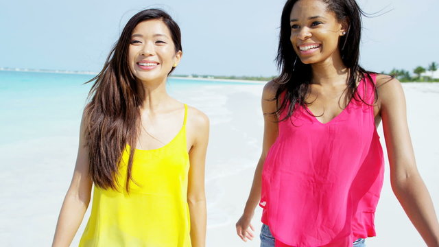 Luxury resort destination smiling multi ethnic female on beach