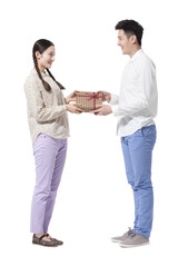 Young man giving gift to woman