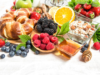 Breakfast croissants, muesli, fruits, berries. Healthy food