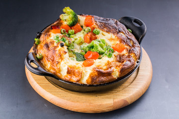 Fresh ham and cheese omelet in fry pan