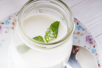 Homemade yogurt on a dark background