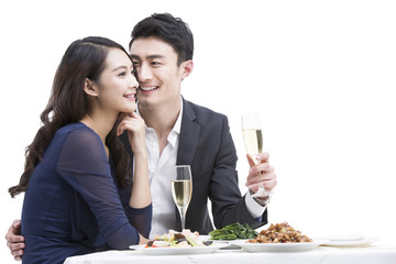 Happy young couple having dinner