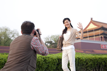 Young couple travelling at Tiananmen Square in Beijing, China