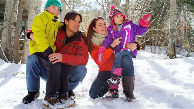 winter skiing vacation Caucasian family parents children snow resort