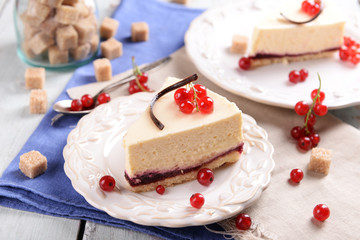 Tasty cheesecake with berries on table close up