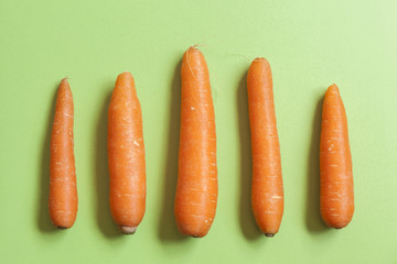 set of carrots on a green countertop