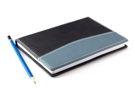 Blue Pencil On Black Leather Moleskin Notebook