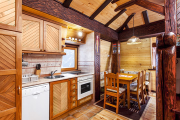 Traditional wooden interior with table and fixtures - mountain room