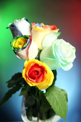 Beautiful bouquet of painted roses on colourful background, close up