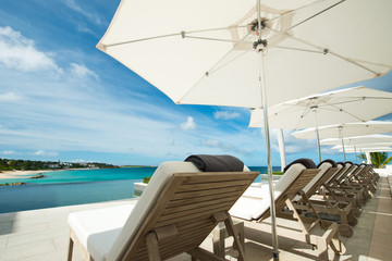 Fototapeta na wymiar Sunbed and umbrella at caribbean