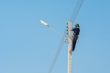 Electrician on a pole
