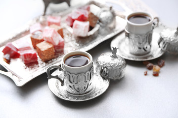Antique tea-set with Turkish delight on table close-up