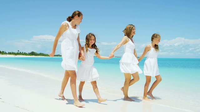 Caucasian family mother girls white clothes beach ocean island vacation tourism