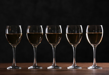 Half full wine glasses on a table