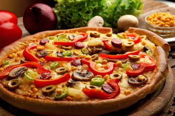 Delicious pizza with vegetables and slice on shovel, close-up