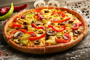 Delicious sliced pizza with vegetables, close-up