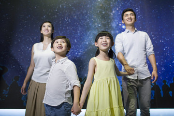 Young family in science and technology museum