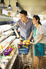 Young couple shopping in supermarket