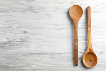 Two wooden spoons on the table, close-up