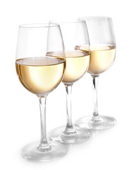 Three glasses of wine on light background