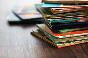 Pile of old books on wooden table