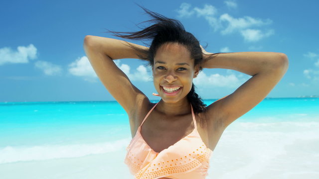 African American girl wearing bikini at leisure vacation resort
