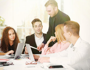 Young business people discussing a new project in a conference room