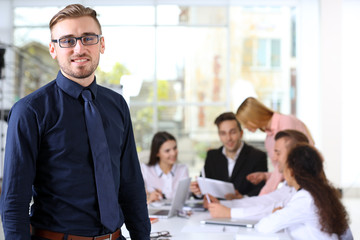 Young business man at the meeting in a conference room