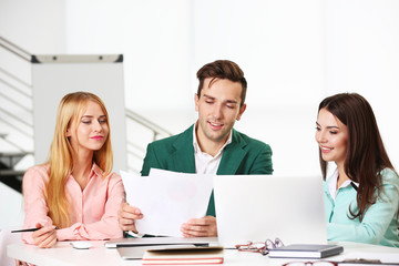 Young business people discussing a new project at the meeting in a conference room