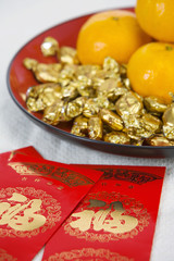 Red Packets Containing Monetary Gifts, With Mandarin Oranges And Sweets