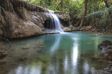 Fototapeta na wymiar tropical waterfall in deep forest of Kanchanaburi province, Thailand.