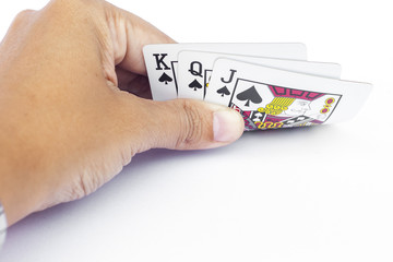 Playing cards in hand isolated on white background