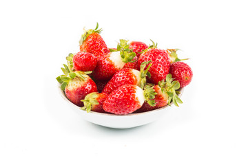 Plateful of freshly harvested organic strawberries with white background