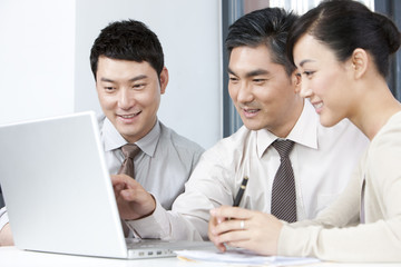 Fototapeta premium Business Executive Explaining to Younger Businesspeople