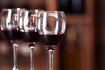 Glasses with red wine in cellar