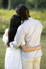 Rear view of young couple standing together