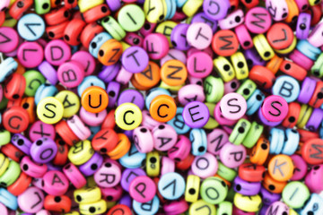 Fototapeta na wymiar Success Text Beads, Seeking Success