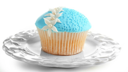 Blue cupcake isolated on white
