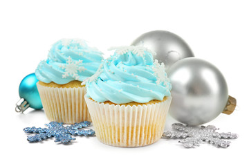 Blue cupcakes and Christmas decor isolated on white